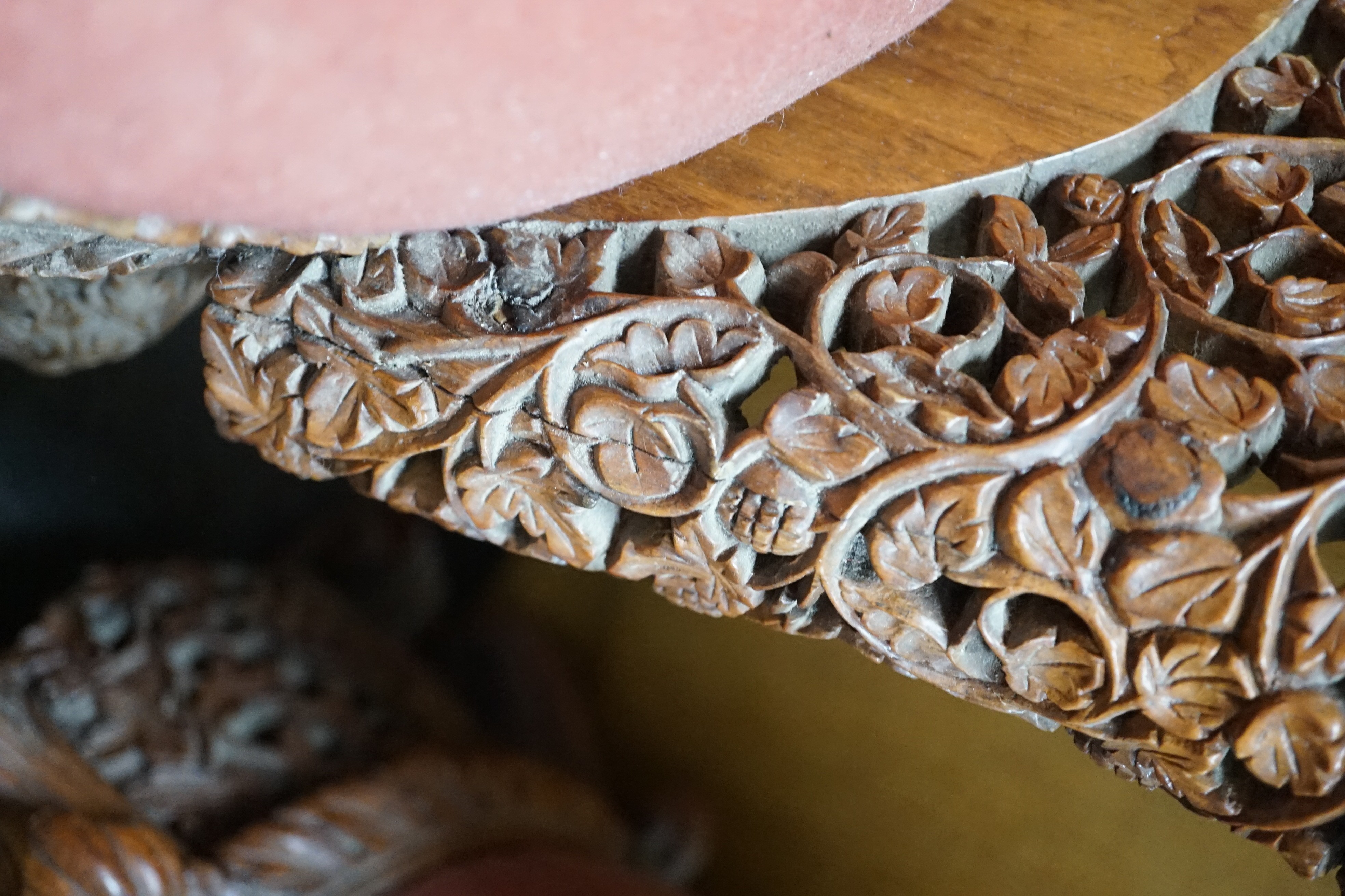 A Burmese carved hardwood circular occasional or centre table, diameter 57cm height 74cm, together with a similar side chair and foot stool
